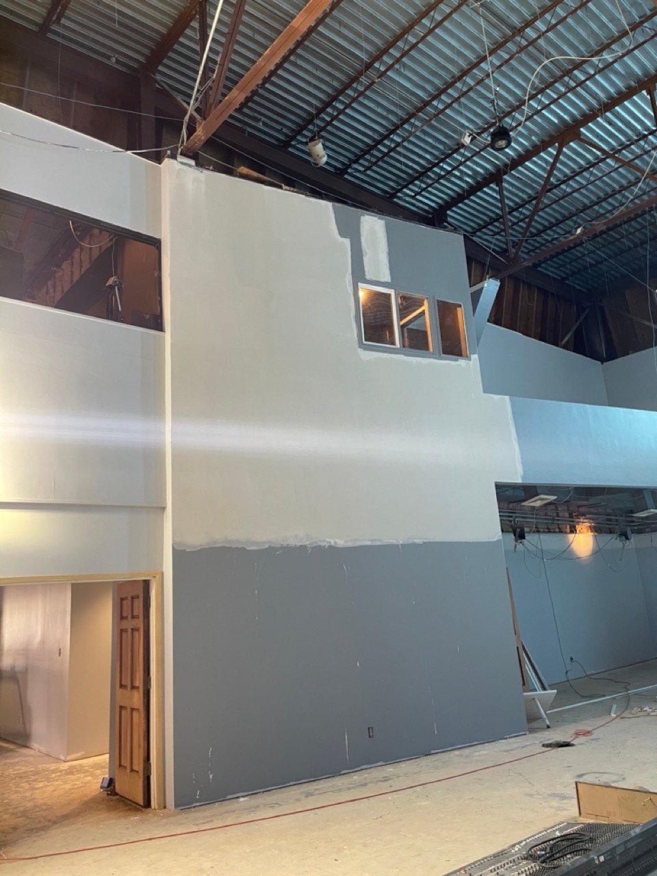 Warehouse buildout drywall and commercial painting in Stafford, TX with two-tone walls