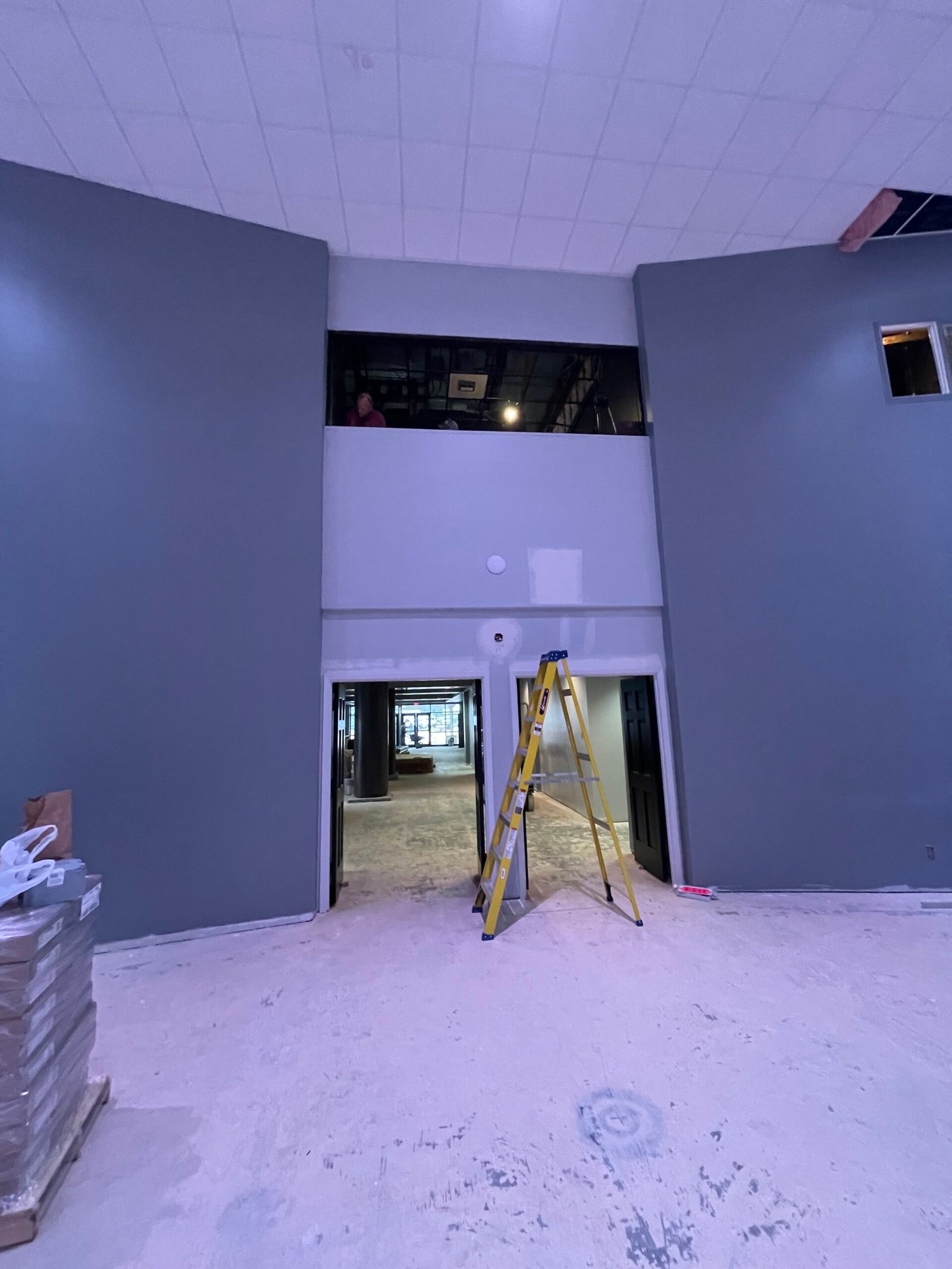 Interior painting in Houston, TX with a large room fully primed before finish coats