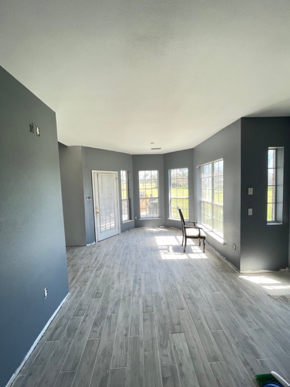 Residential painting in Spring, TX showing a completed open-plan interior repaint